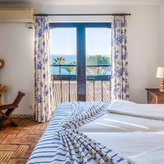 Algar Seco Parque | Carvoeiro, Algarve | schlafzimmer mit direktem meerblick ferienwohnung