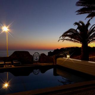 Algar Seco Parque | Carvoeiro, Algarve | nighttime view of pool and palm trees
