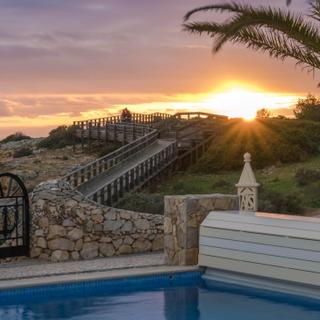 Algar Seco Parque | Carvoeiro, Algarve | pool and carvoeiro boardwalk at dusk