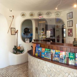 Algar Seco Parque | Carvoeiro, Algarve | reception desk with information pamphlets and glass divider